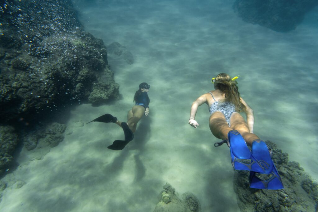 Women free diving at Hanauma Bay